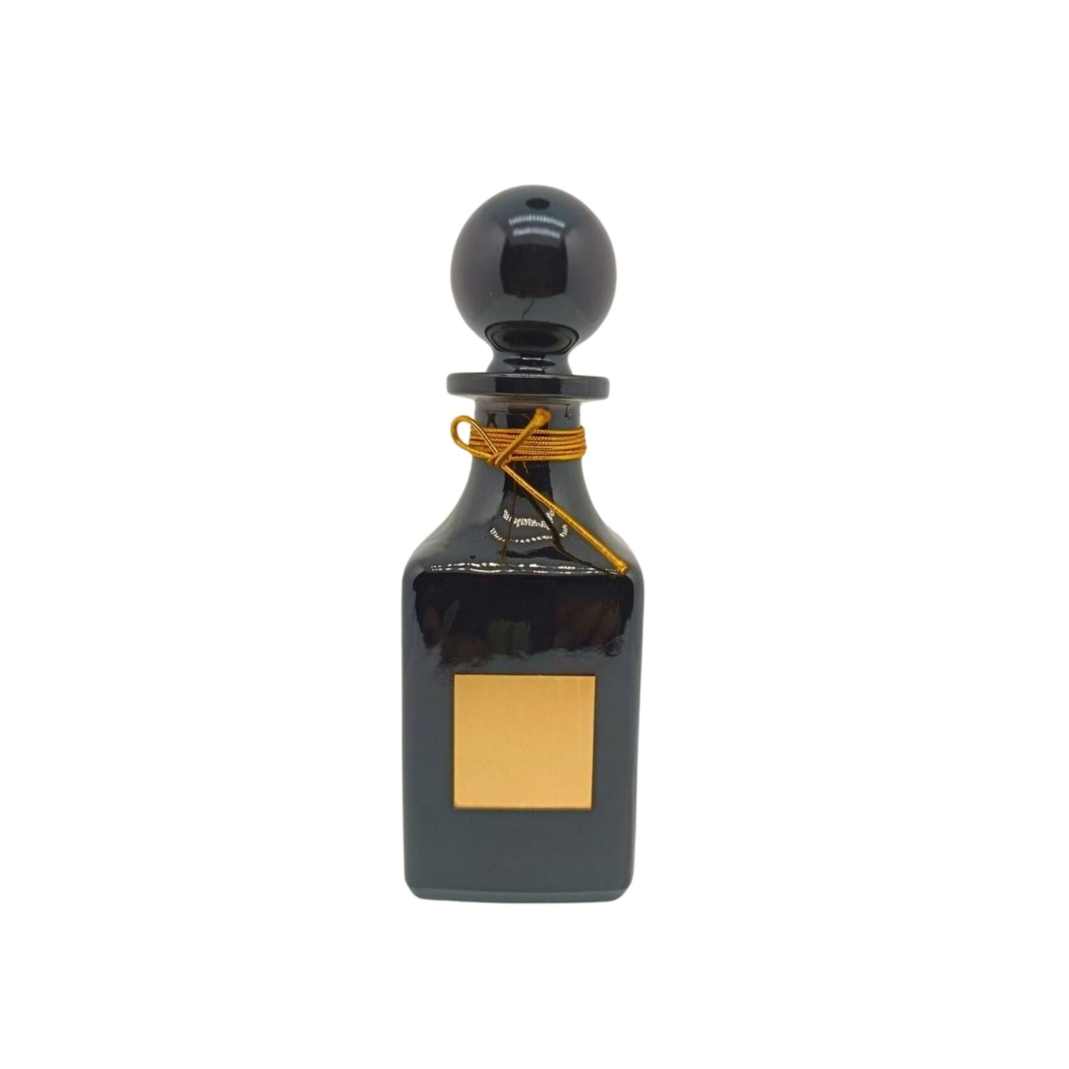 black shiny perfume oil decanter with gold lid