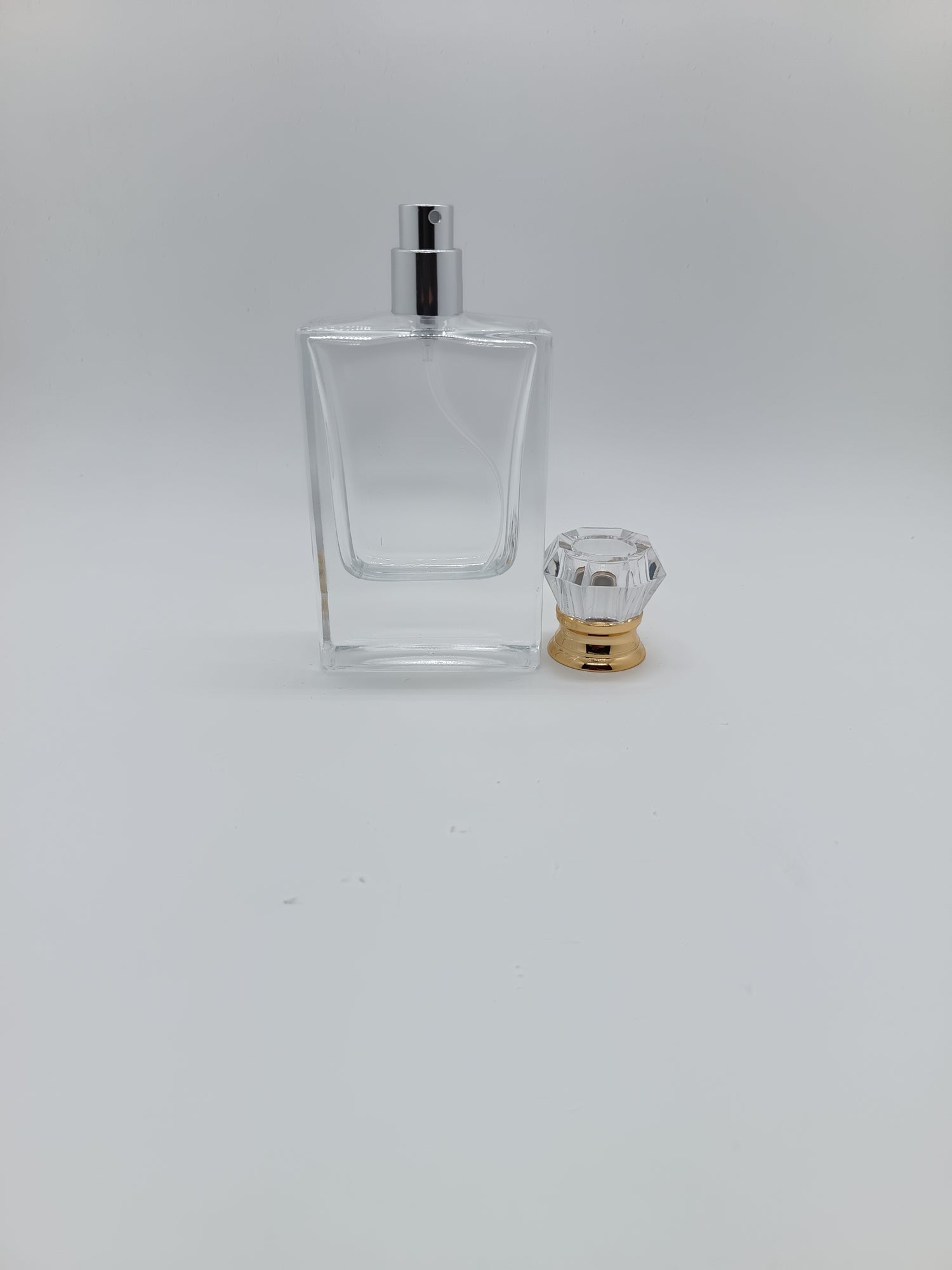Empty spray perfume bottle gold and clear lid - crimp cap 50ml